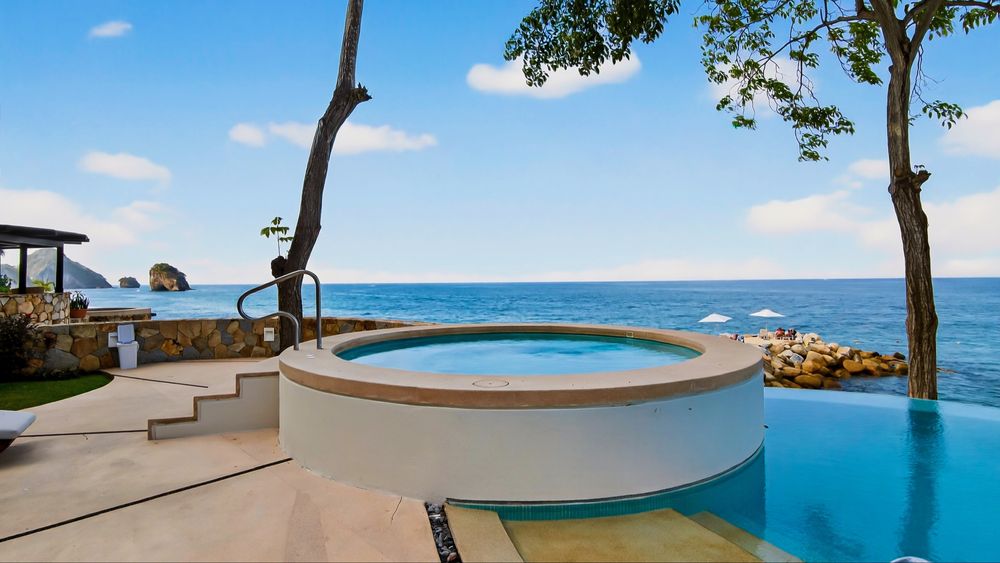 Hot tub beside the community pool with Los Arcos in the distance