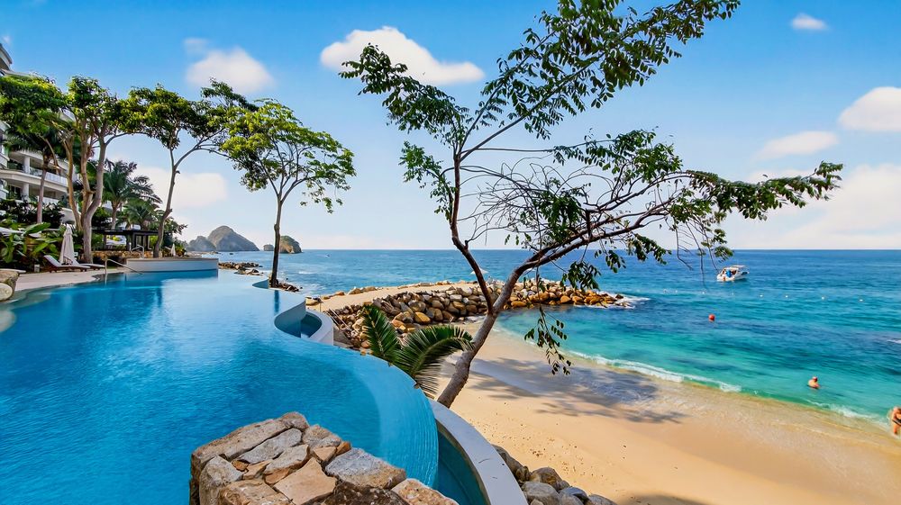 Community pool above the beach at El Nido De Bonnie Tres, Puerto Vallarta