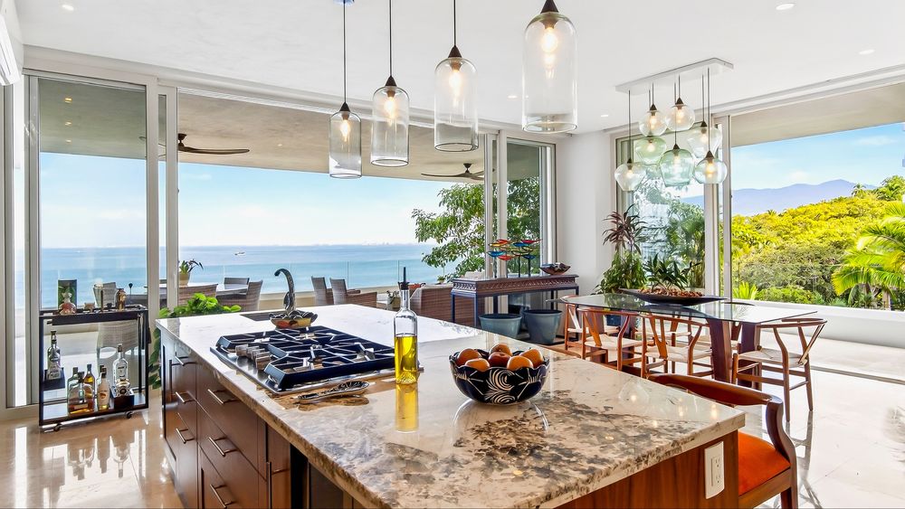 Kitchen island and dining table with ocean views
