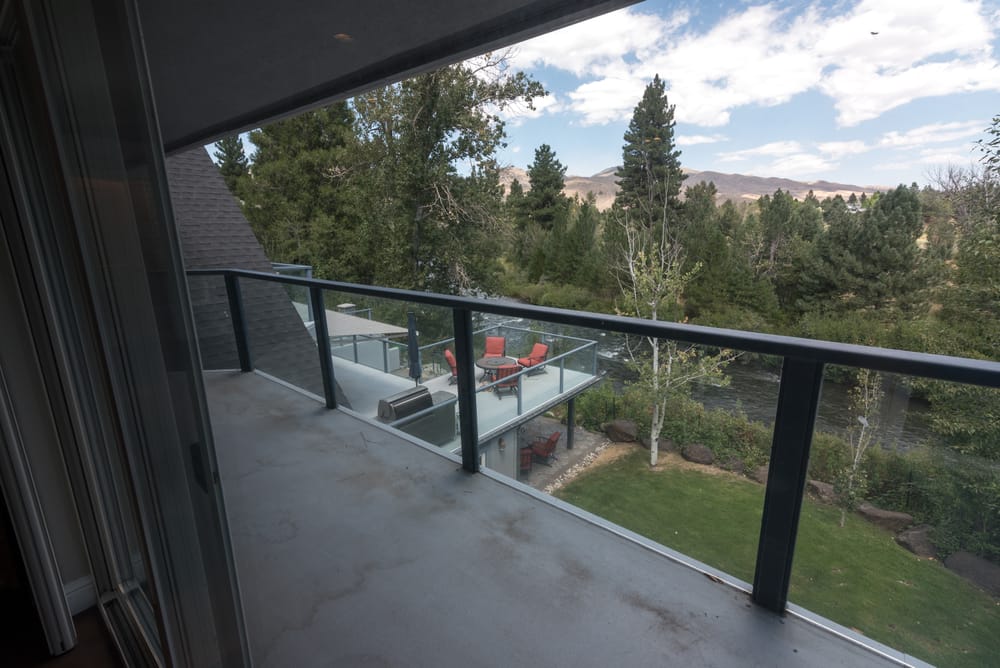 Upstairs balcony overlooking the yard and trees