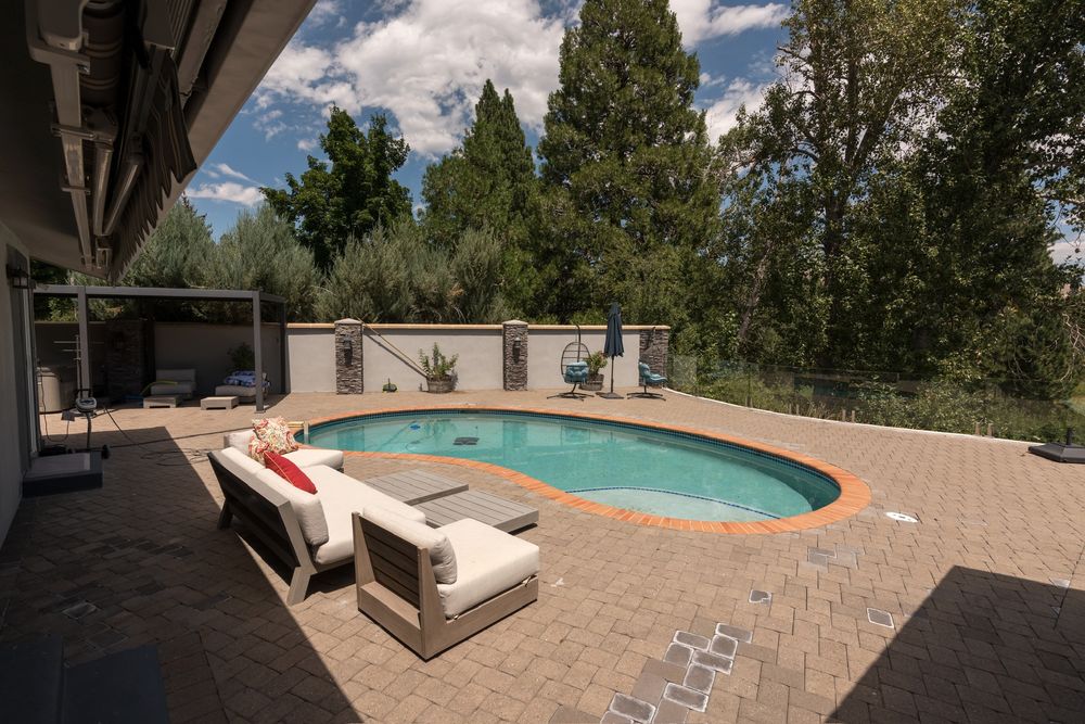 Backyard pool with lounge seating